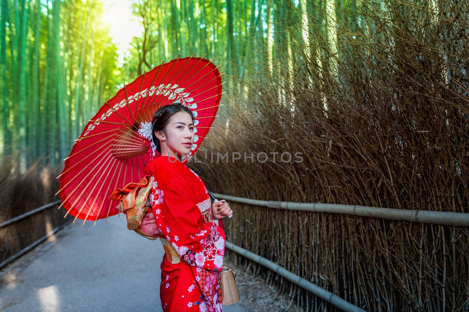 Bamboo Forest. Asian woman wearing japanese traditional kimono at Bamboo Forest in Kyoto, Japan.