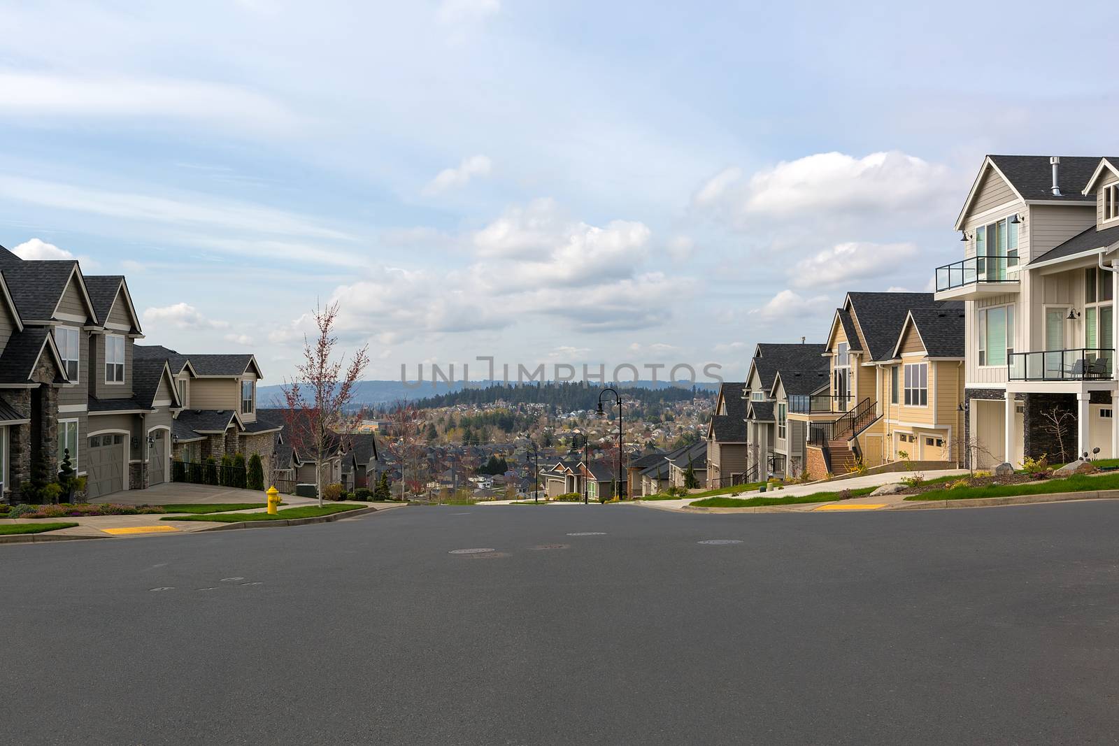 New North American suburban neighborhood upscale homes along street in Happy Valley Oregon United States