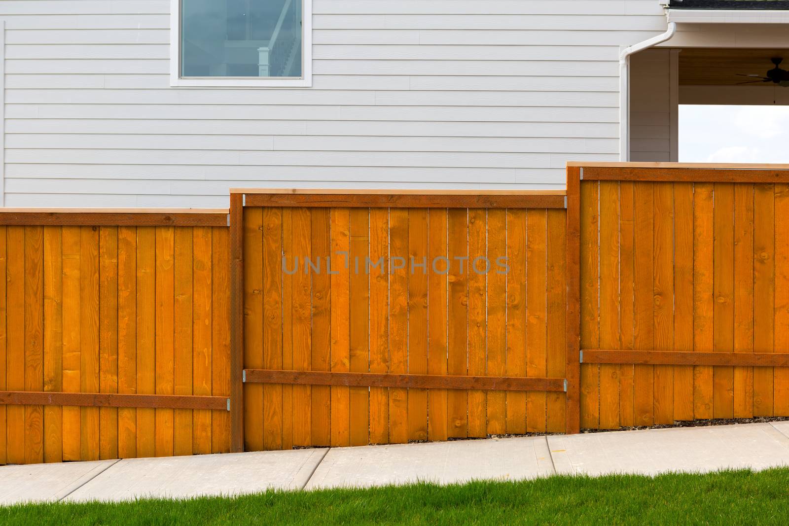 New Red Stained Garden Wood Fence Construction by jpldesigns