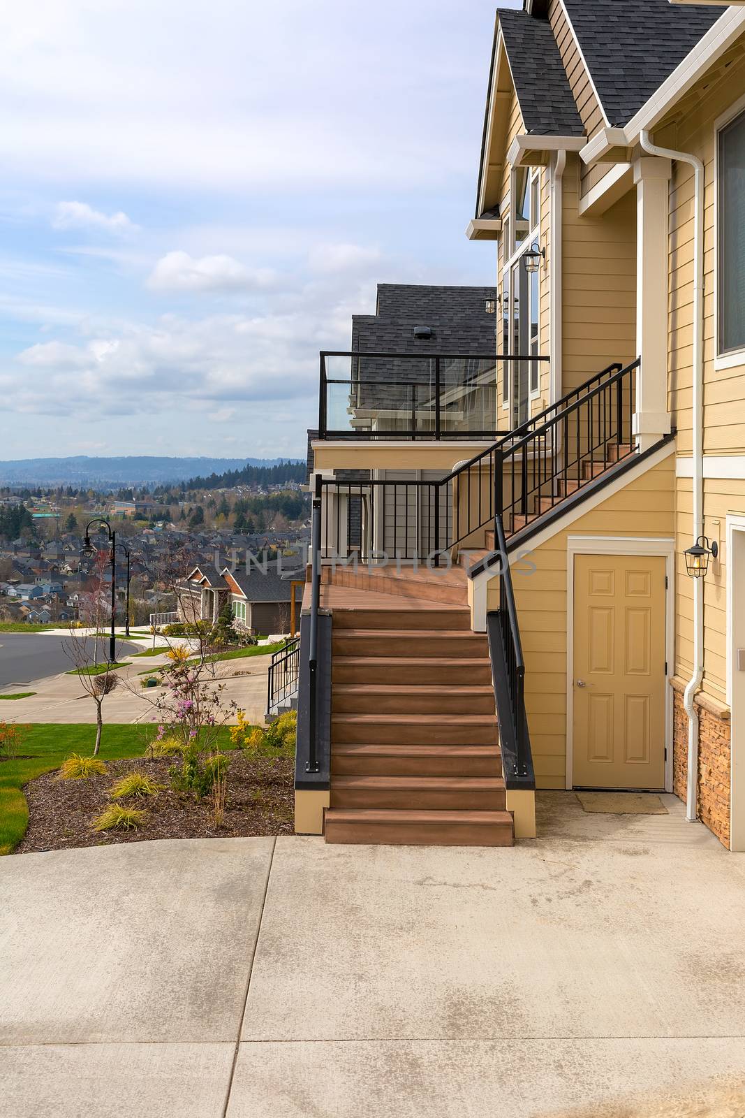 New home in suburban neighborhood front door entrance staircase