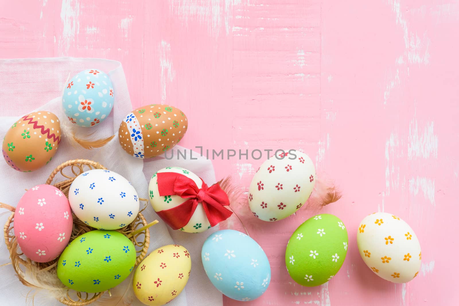 Happy easter! Colorful of Easter eggs tied with red ribbon in ne by spukkato