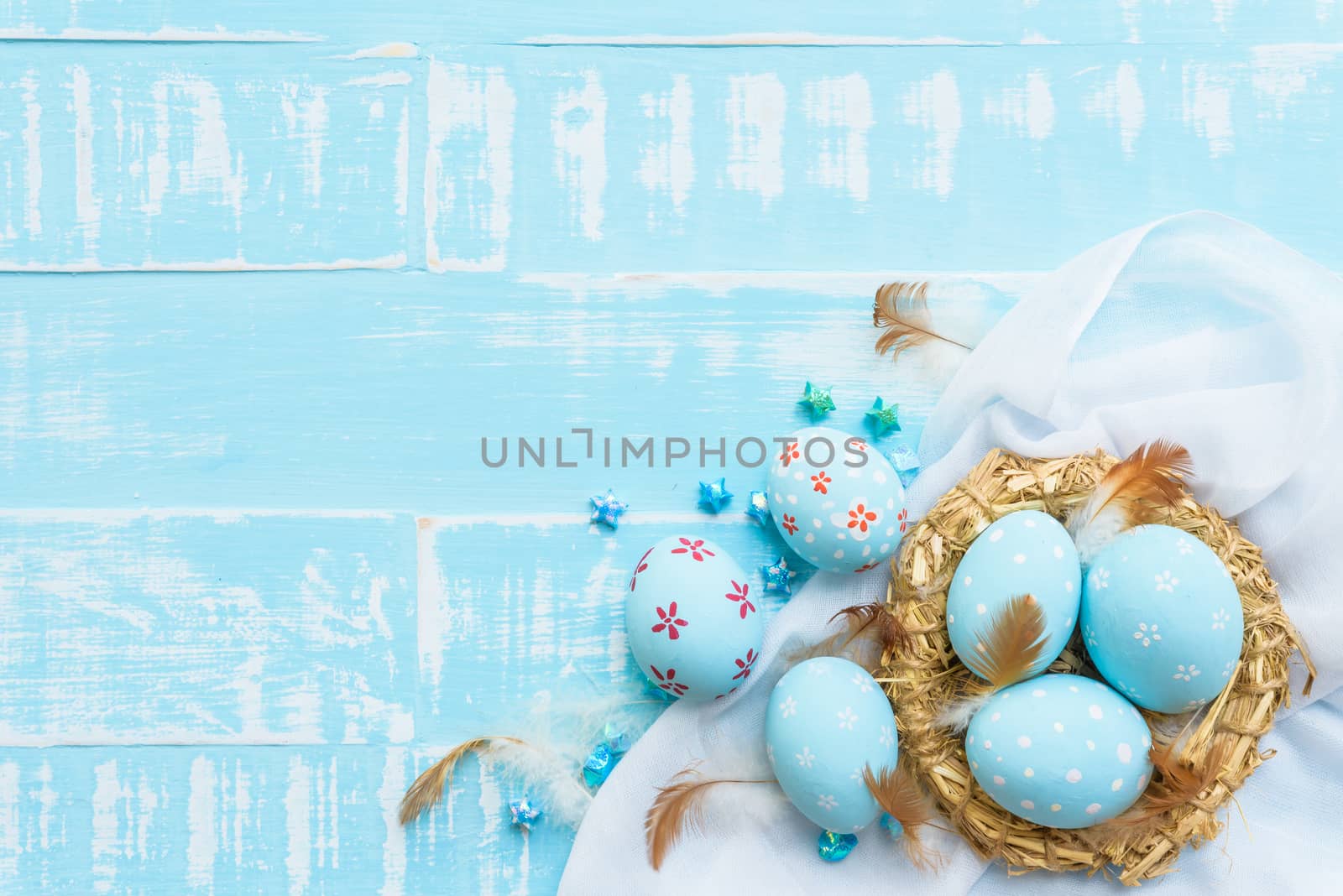 Happy easter! Colorful of Easter eggs in nest with paper star, f by spukkato