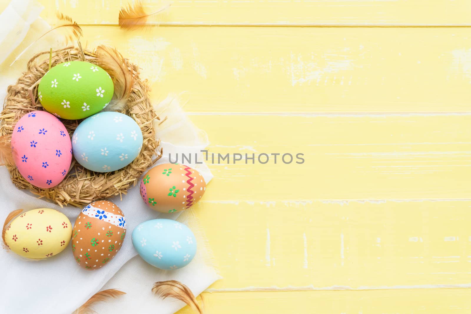 Happy easter! Colorful of Easter eggs in nest with red ribbon, F by spukkato
