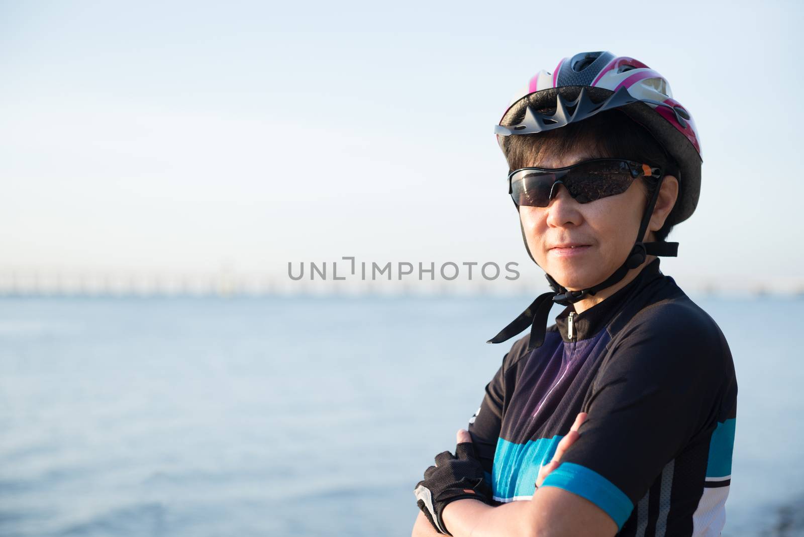 Portrait of senior woman cyclist by Kenishirotie