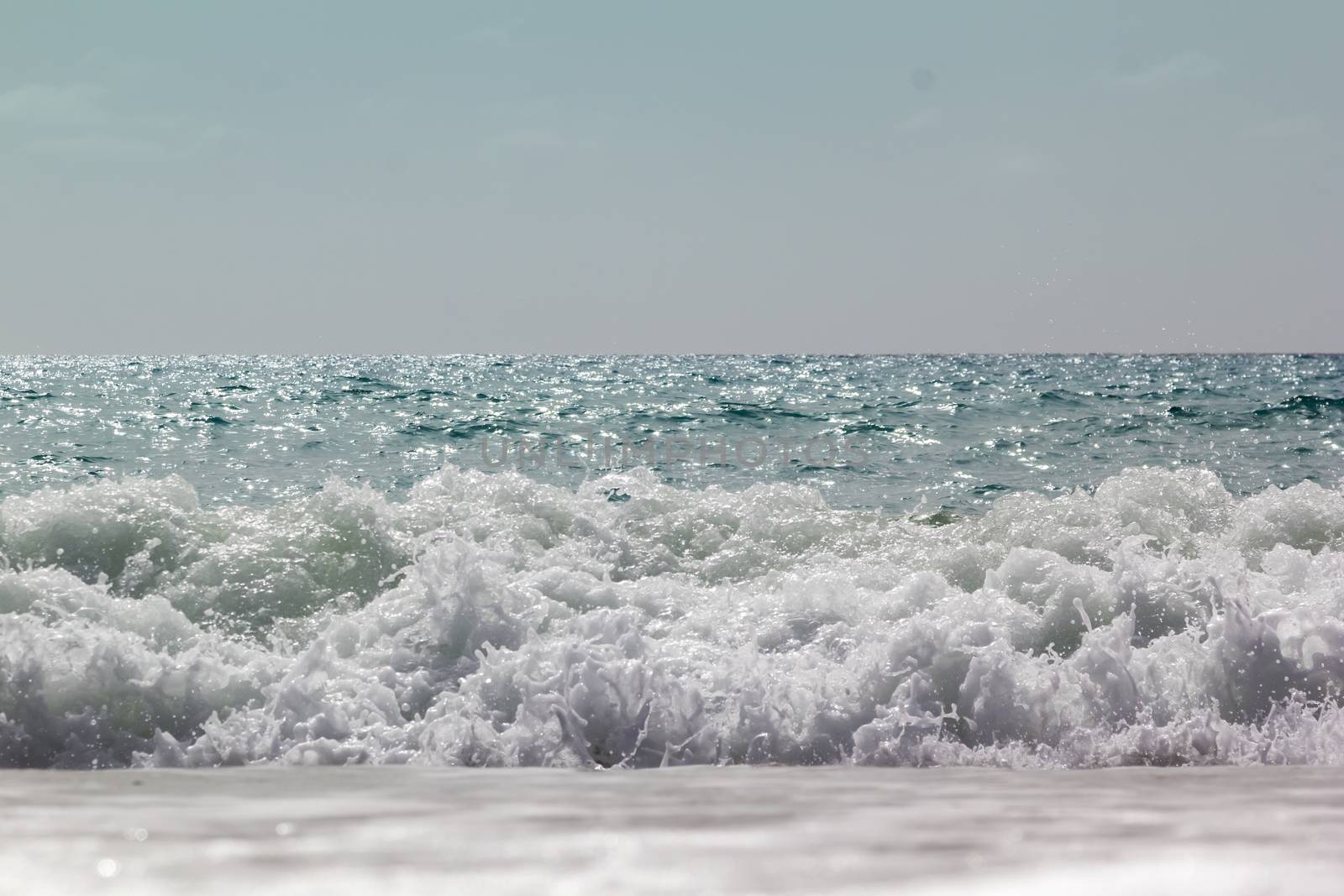 Soft wave of ocean on the sandy beach Antalya