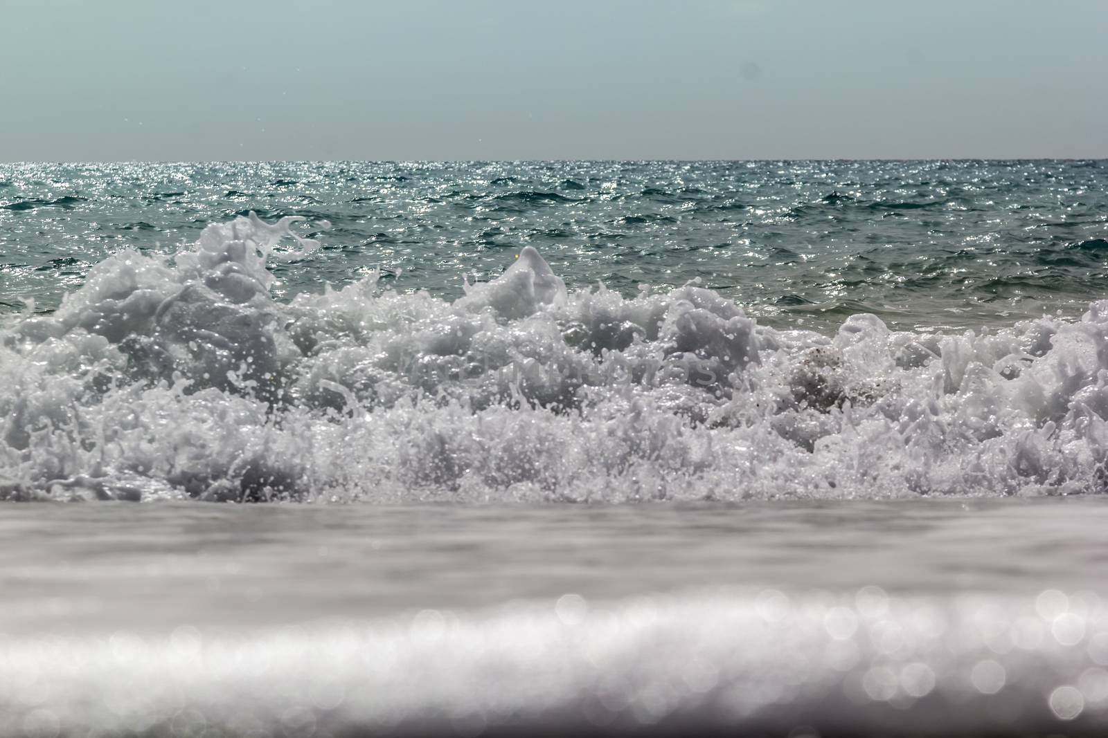 Soft wave of ocean on the sandy beach Antalya