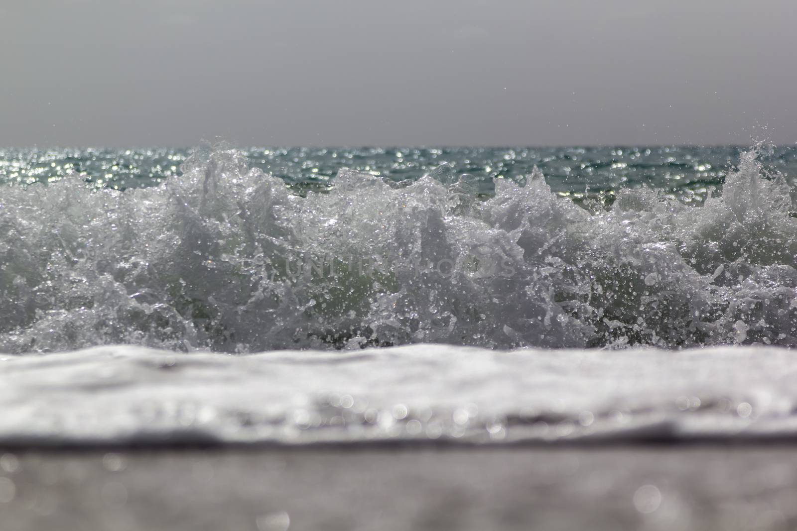 Soft wave of ocean on the sandy beach Antalya