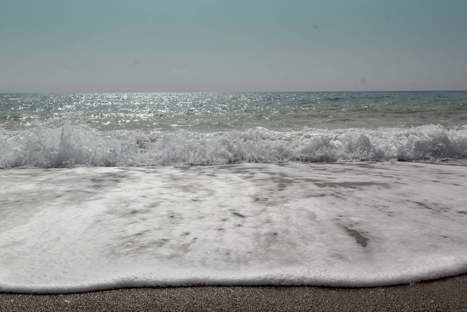 Soft wave of ocean on the sandy beach Antalya