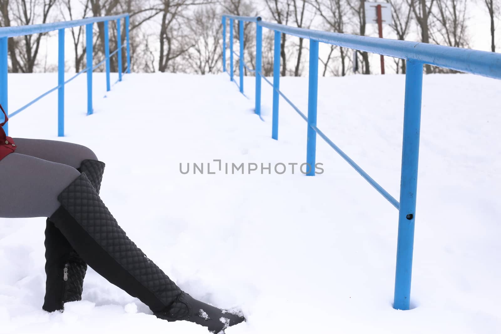 women's hands in gloves. keep snow and orange. white background, winter.