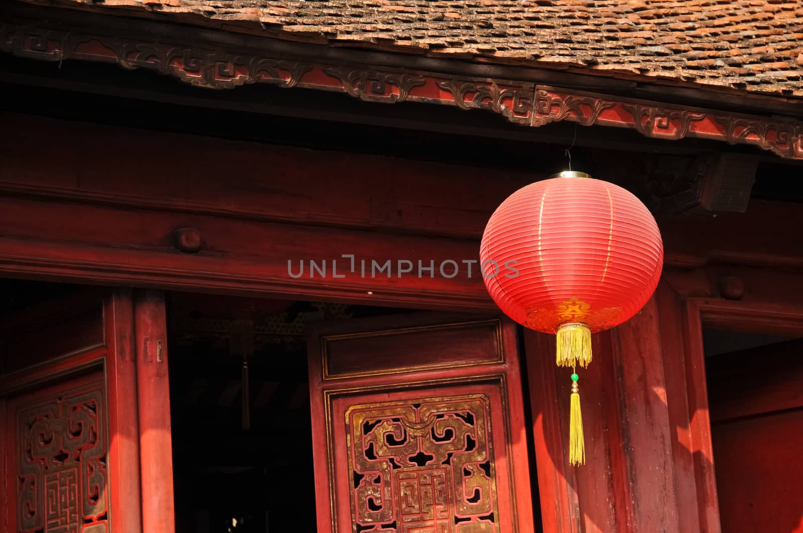 Classical red paper Chinese lantern in sacred shrine in Hanoi Vietnam