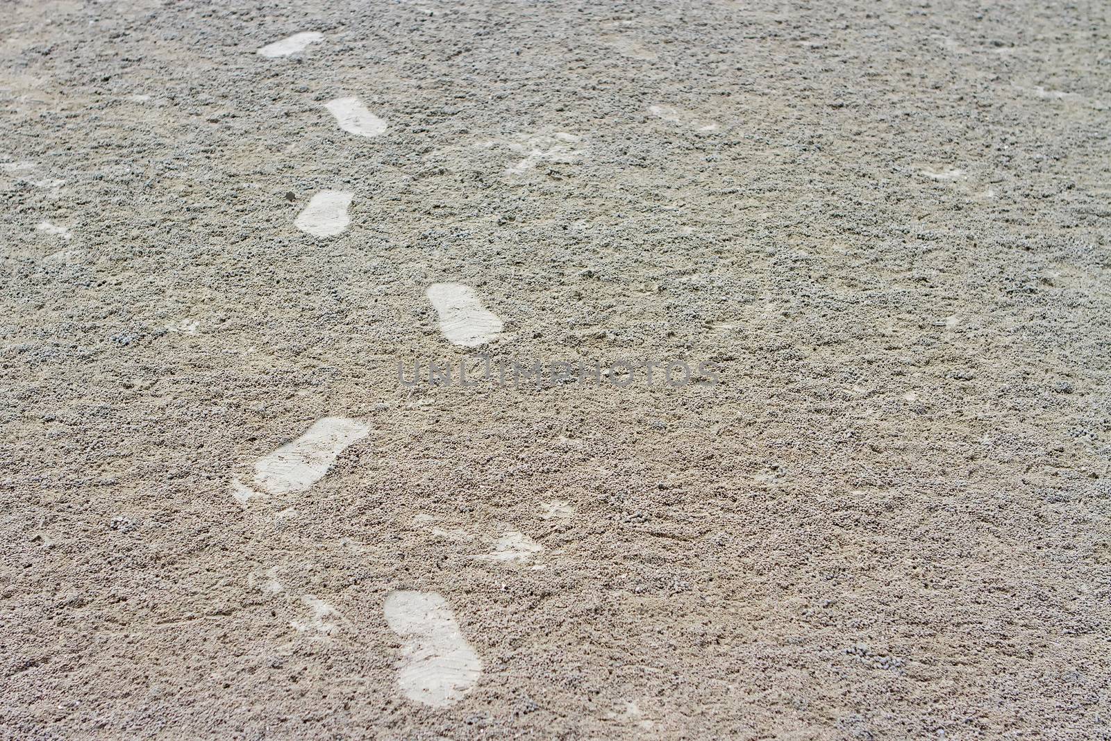 Footprint on cream sand