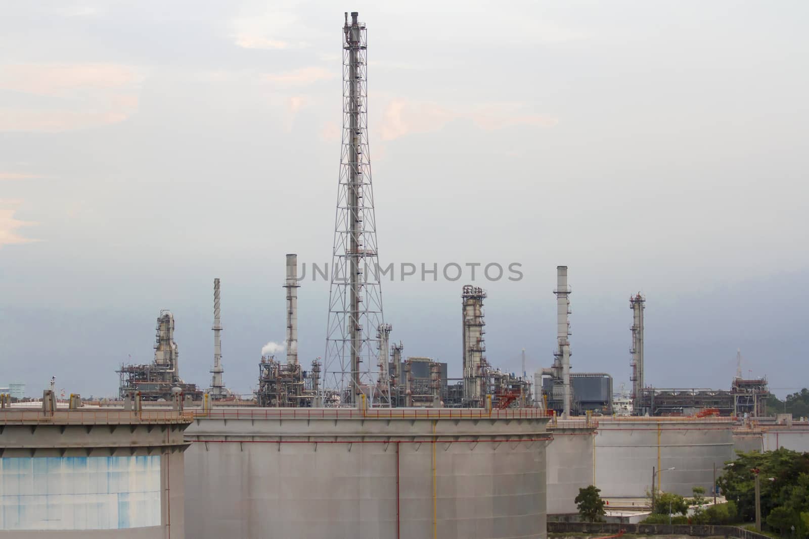 Oil refinery with evening sky. by TakerWalker