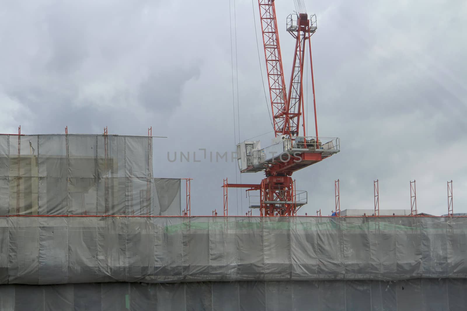 Red crane is under construction. by TakerWalker