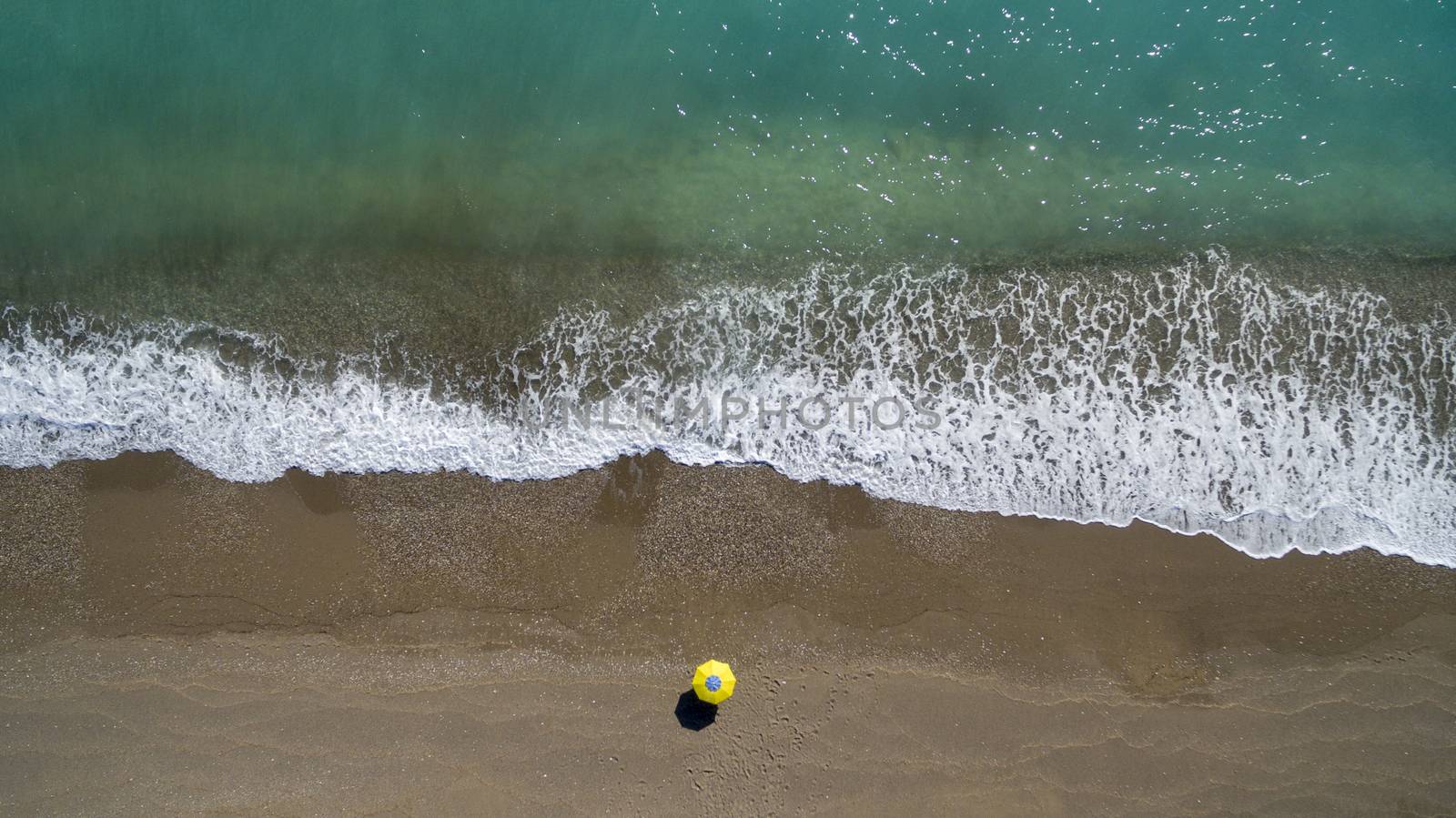 AERIAL: sunbathing on beach. No people only umbrella Antalya