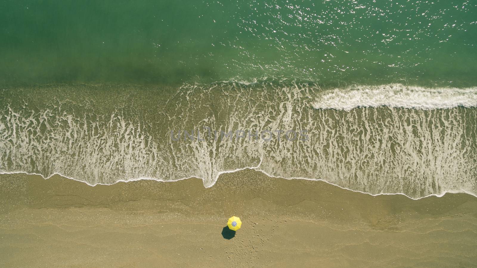 AERIAL: sunbathing on beach. No people only umbrella Antalya