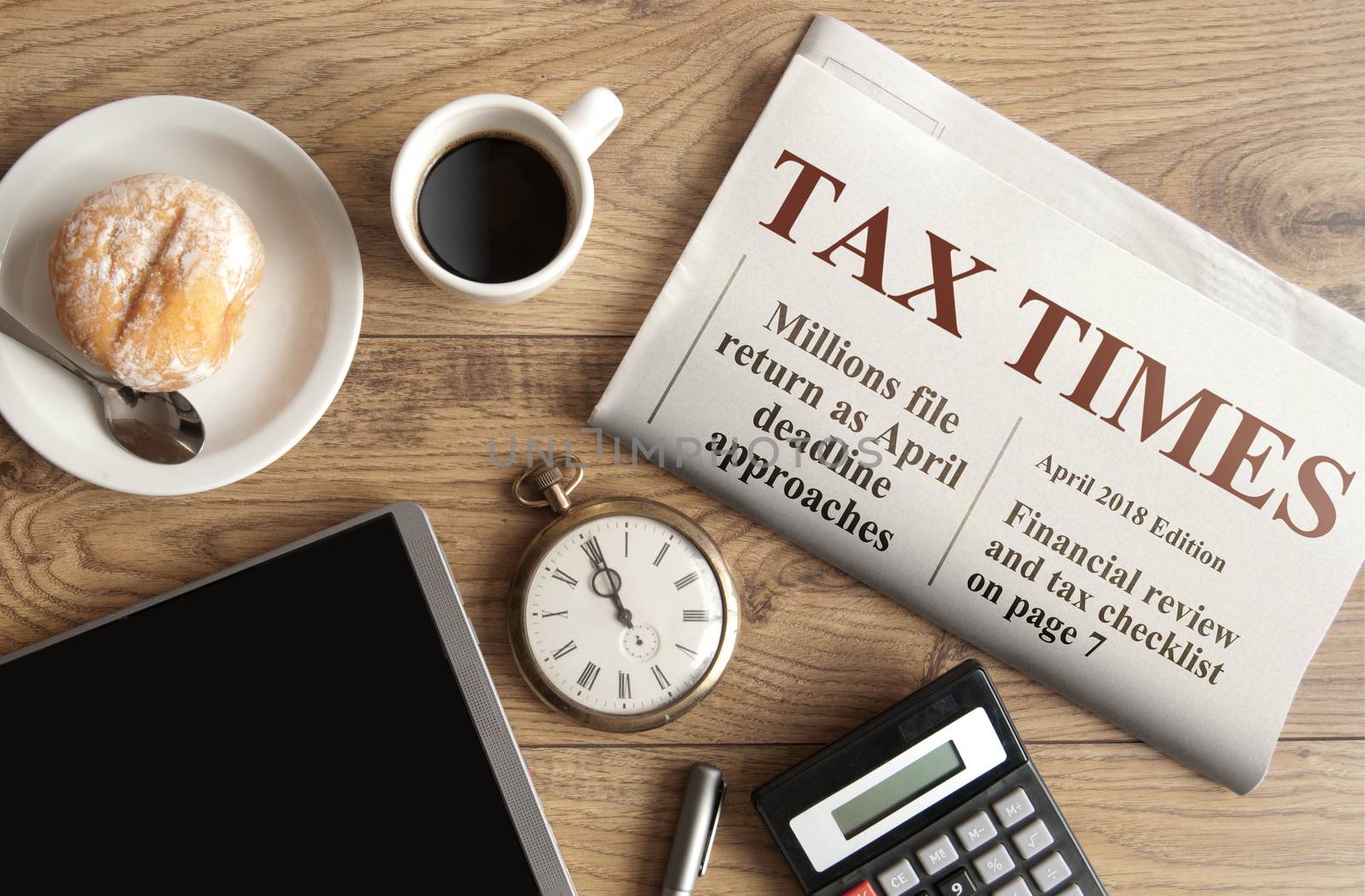 Tax times mock up newspaper with clock, calculator and tablet 