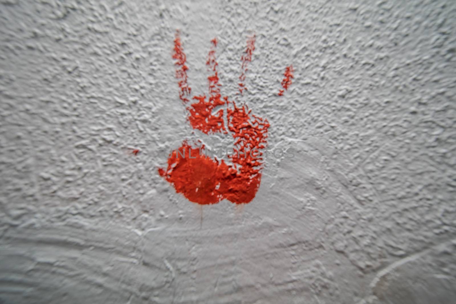 bloody palm print on concrete wall crime scene