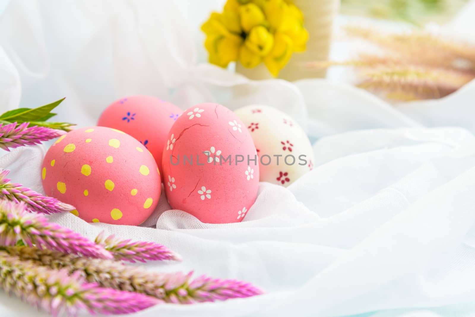 Happy easter! Colorful of Easter eggs in nest with flower,  pape by spukkato