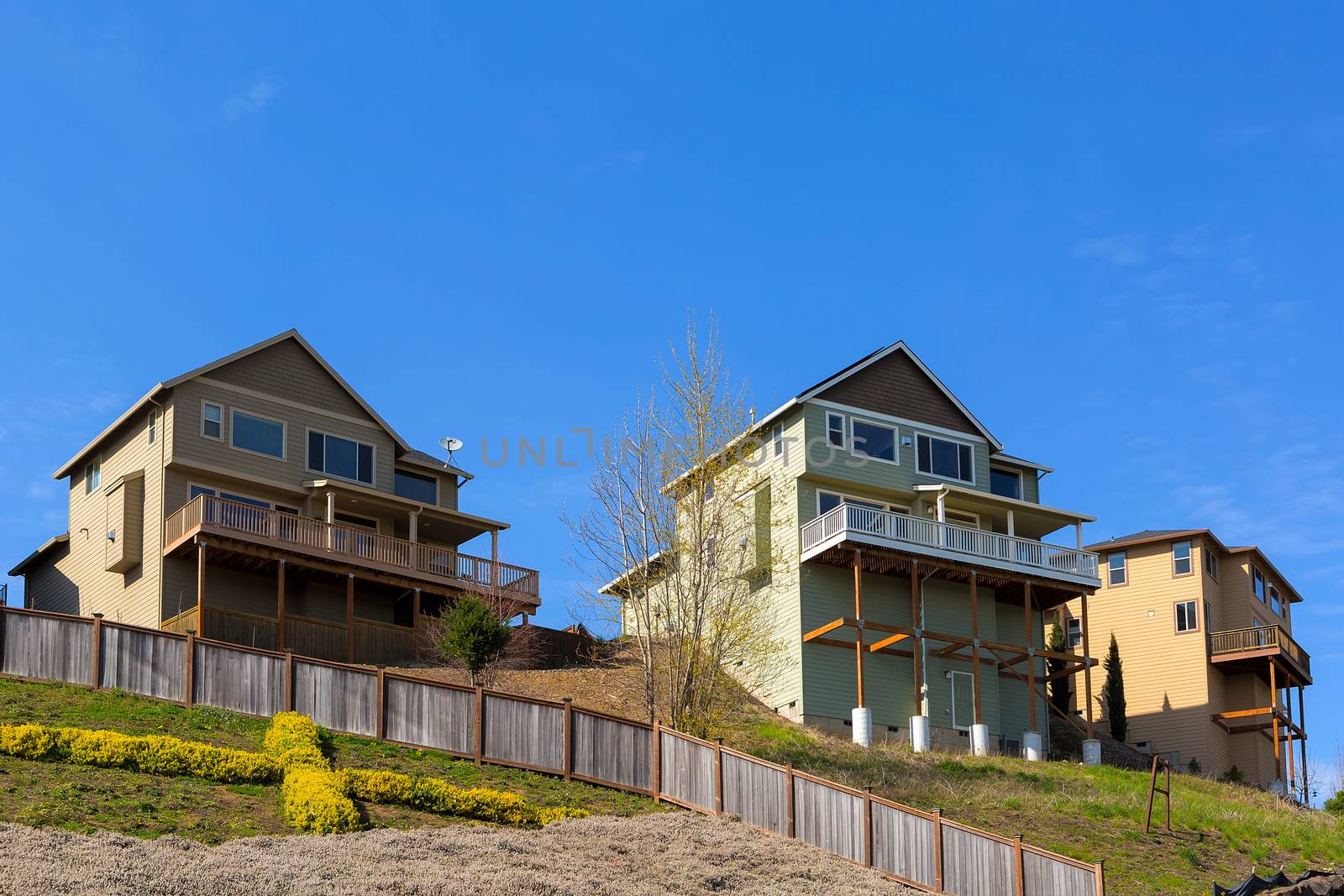 Homes on Stilts along Hillside Lots by jpldesigns