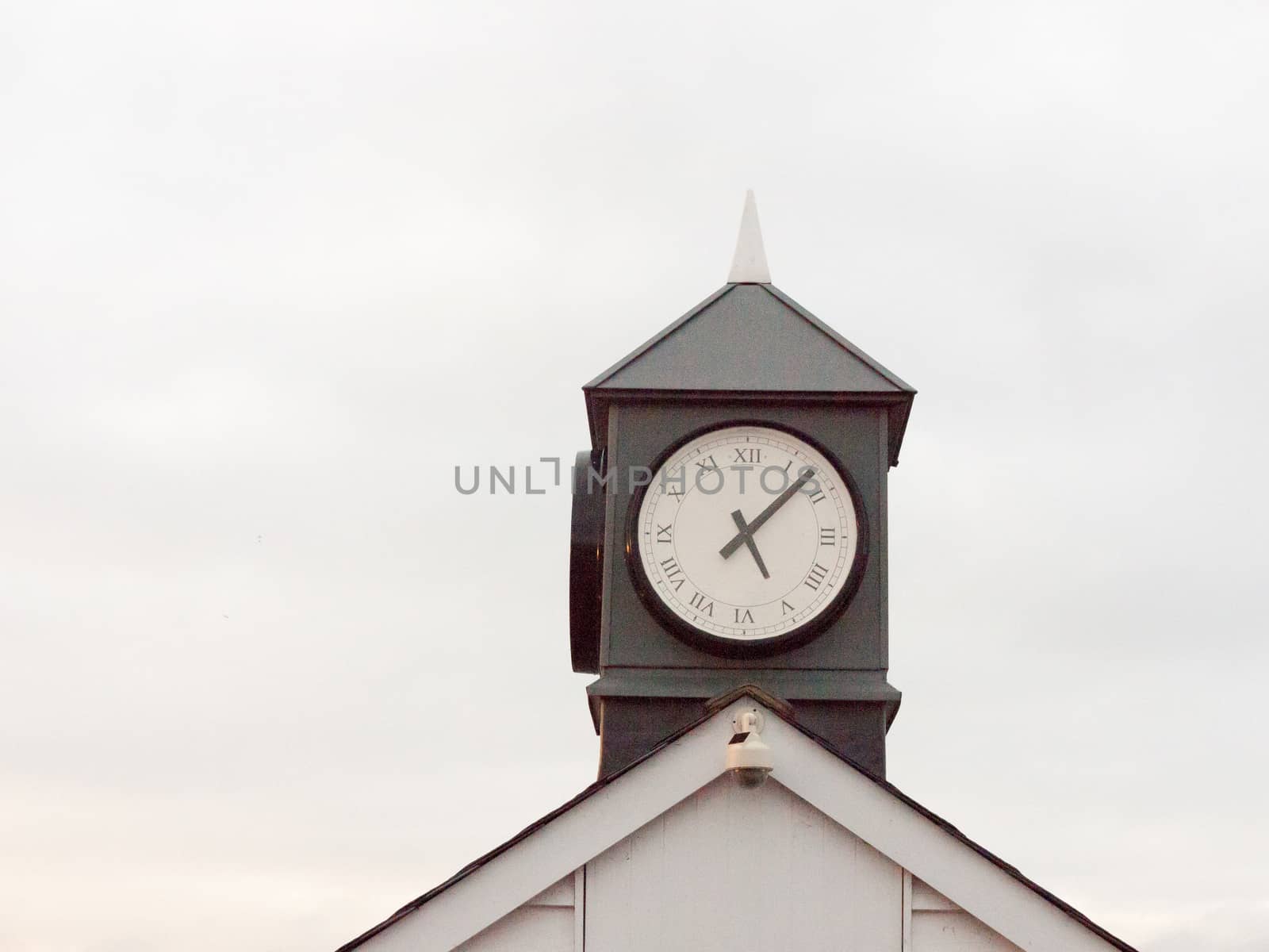 old analogue clock black and white tower of town tower building sky; essex; england; uk