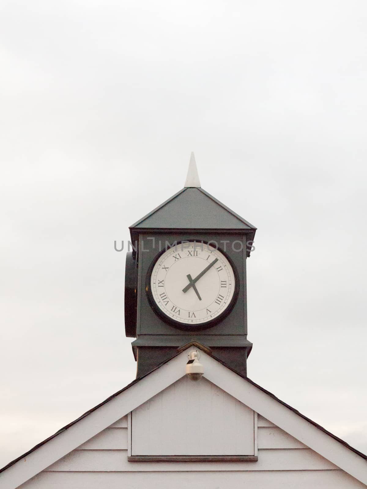 old analogue clock black and white tower of town tower building sky; essex; england; uk