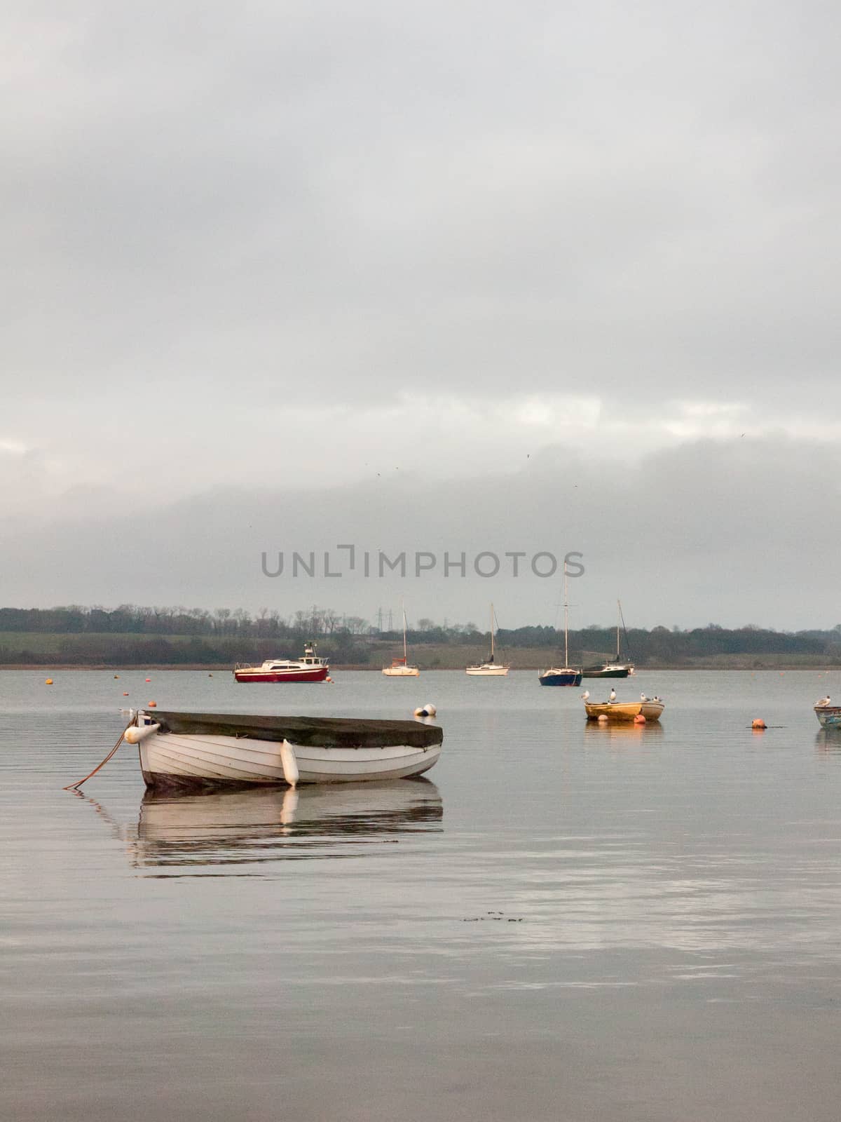 sunset over coast ocean bay water sky sea boats docks moored by callumrc