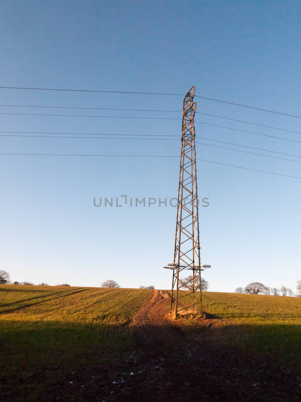 large metal tower field farm blue sky electric pylon communicati by callumrc
