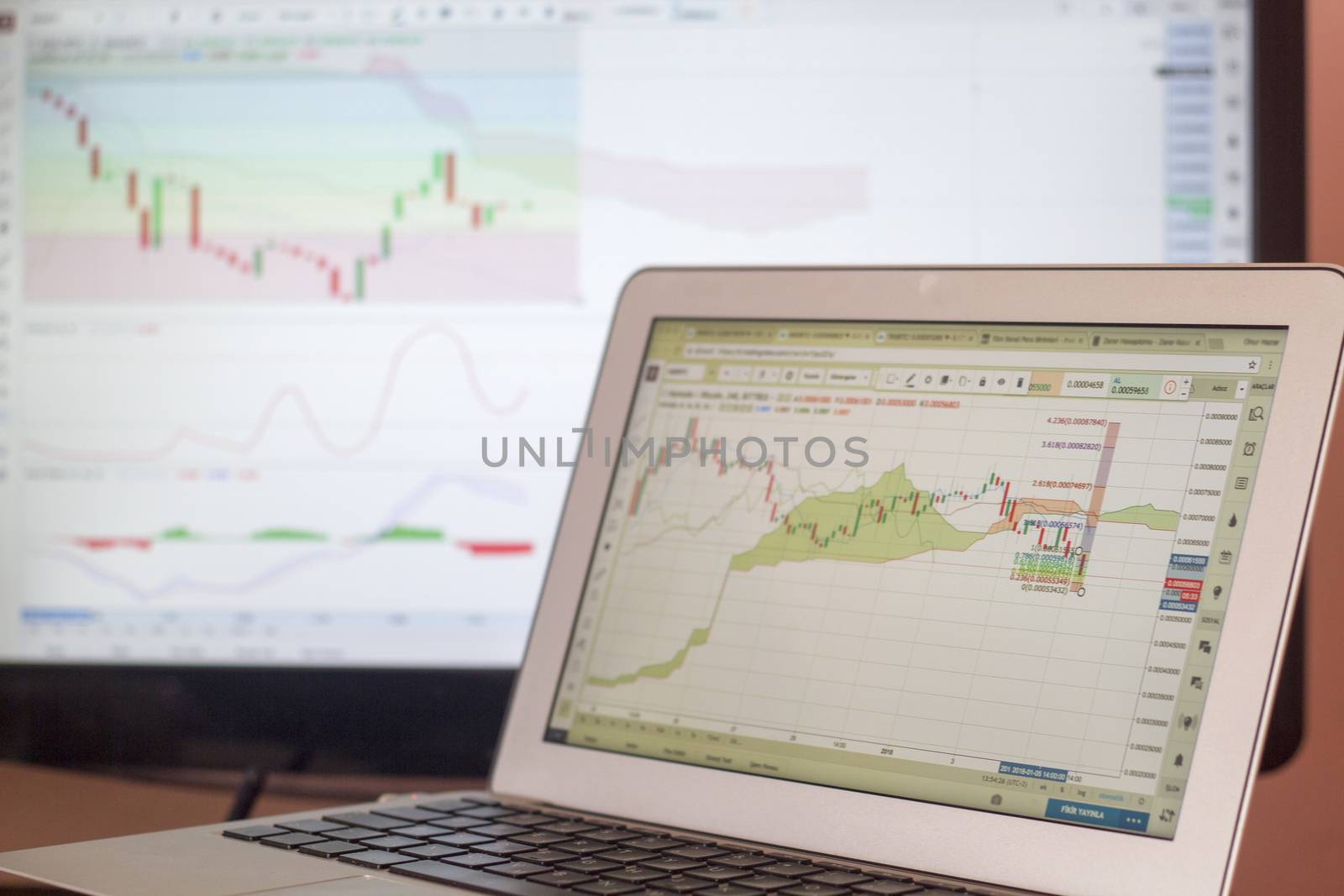 Candle stick chart of stock market on laptop display by oaltindag