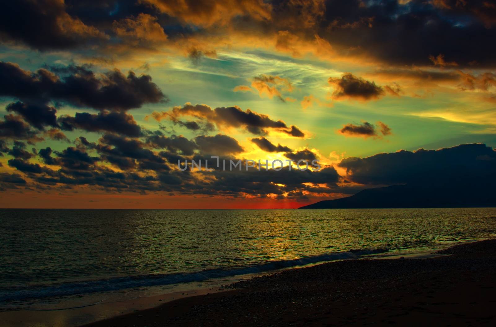 Nature in twilight period which including of sunrise over the sea and the nice beach. Summer beach with blue water and purple sky at the sunset.