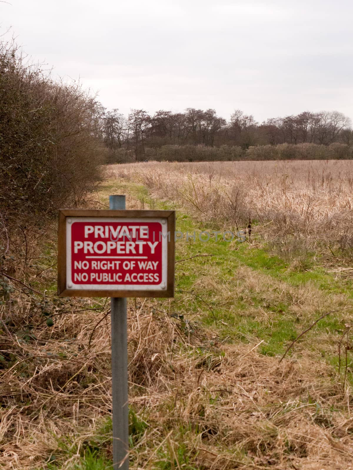 red wooden private property sign farm land no right of way no public access; essex; england; uk