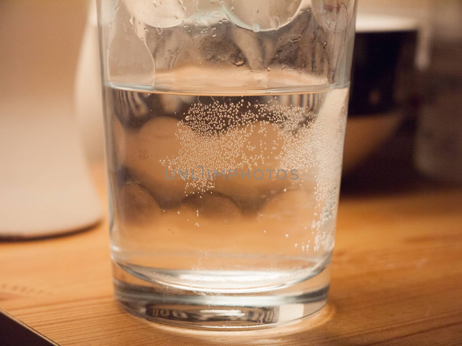 close up macro texture bubbles on glass of water desk by callumrc