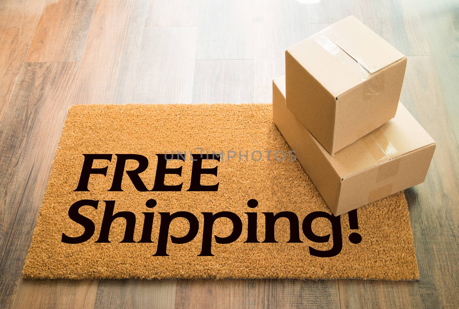 Free Shipping Welcome Mat On Wood Floor With Shipment of Boxes.