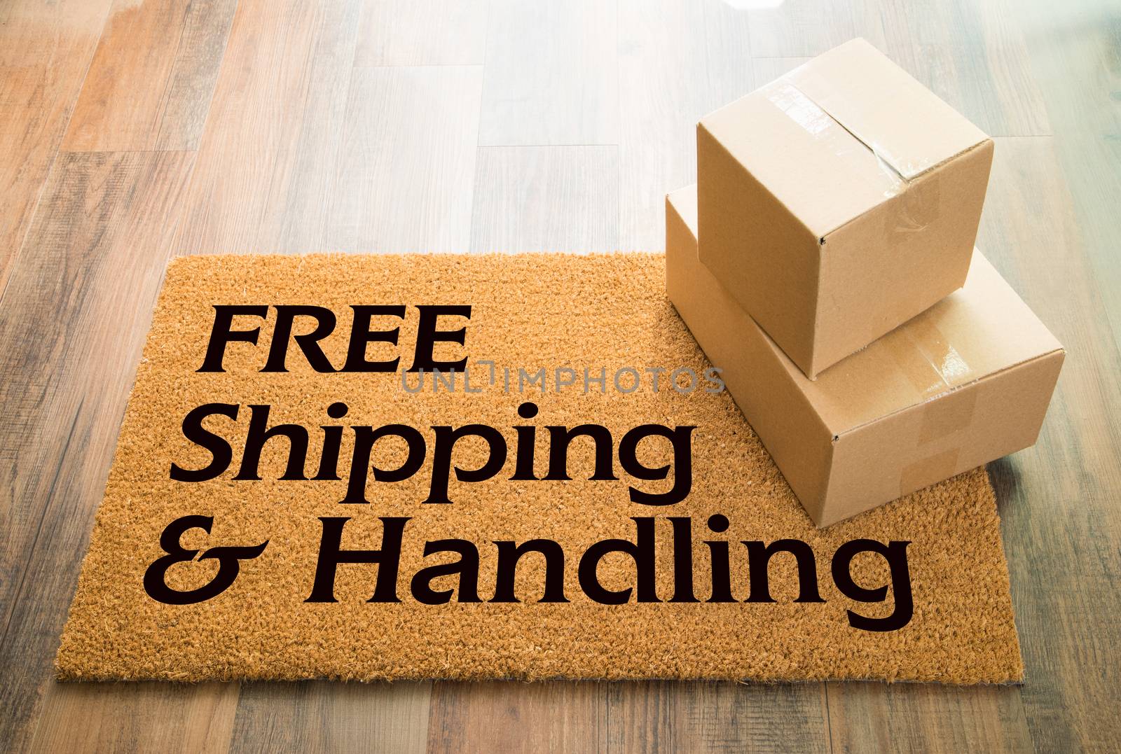 Free Shipping and Handling Welcome Mat On Wood Floor With Shipment of Boxes.