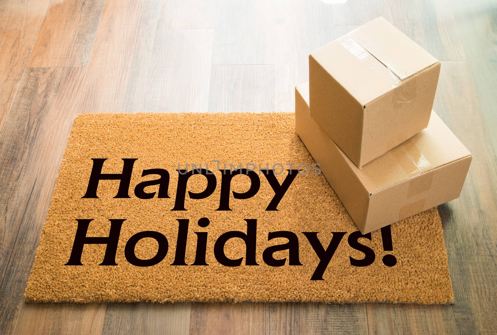 Happy Holidays Welcome Mat On Wood Floor With Shipment of Boxes by Feverpitched