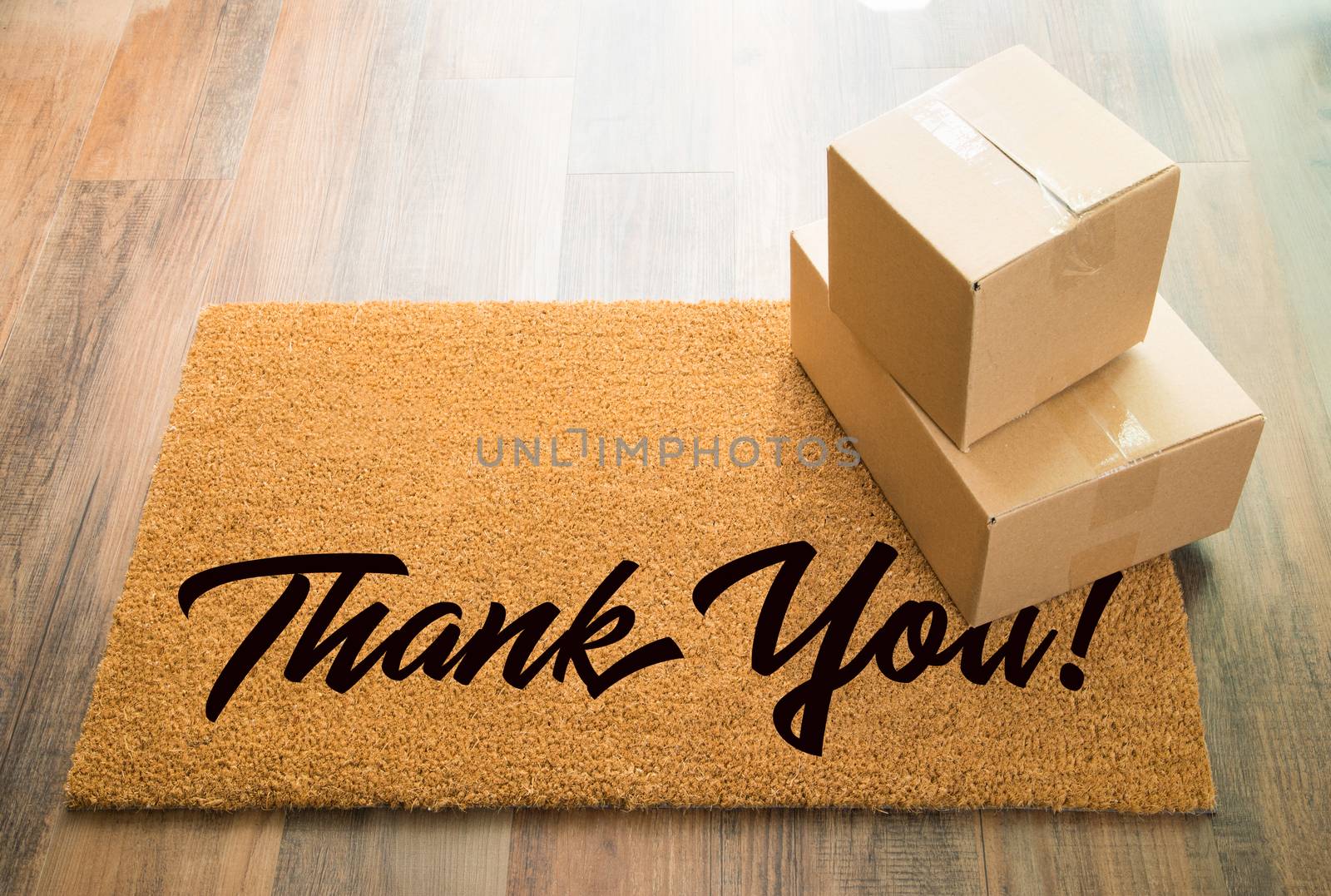 Thank You Welcome Mat On Wood Floor With Shipment of Boxes by Feverpitched