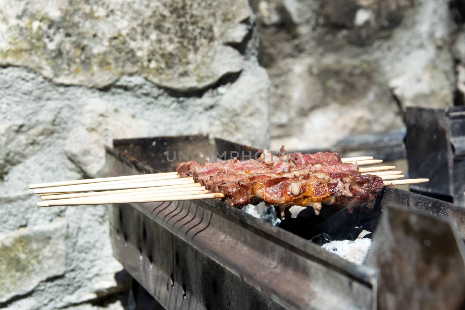 Arrosticini on the grill, Abruzzi skewers of sheep cooked on the grate and on a special brazier.