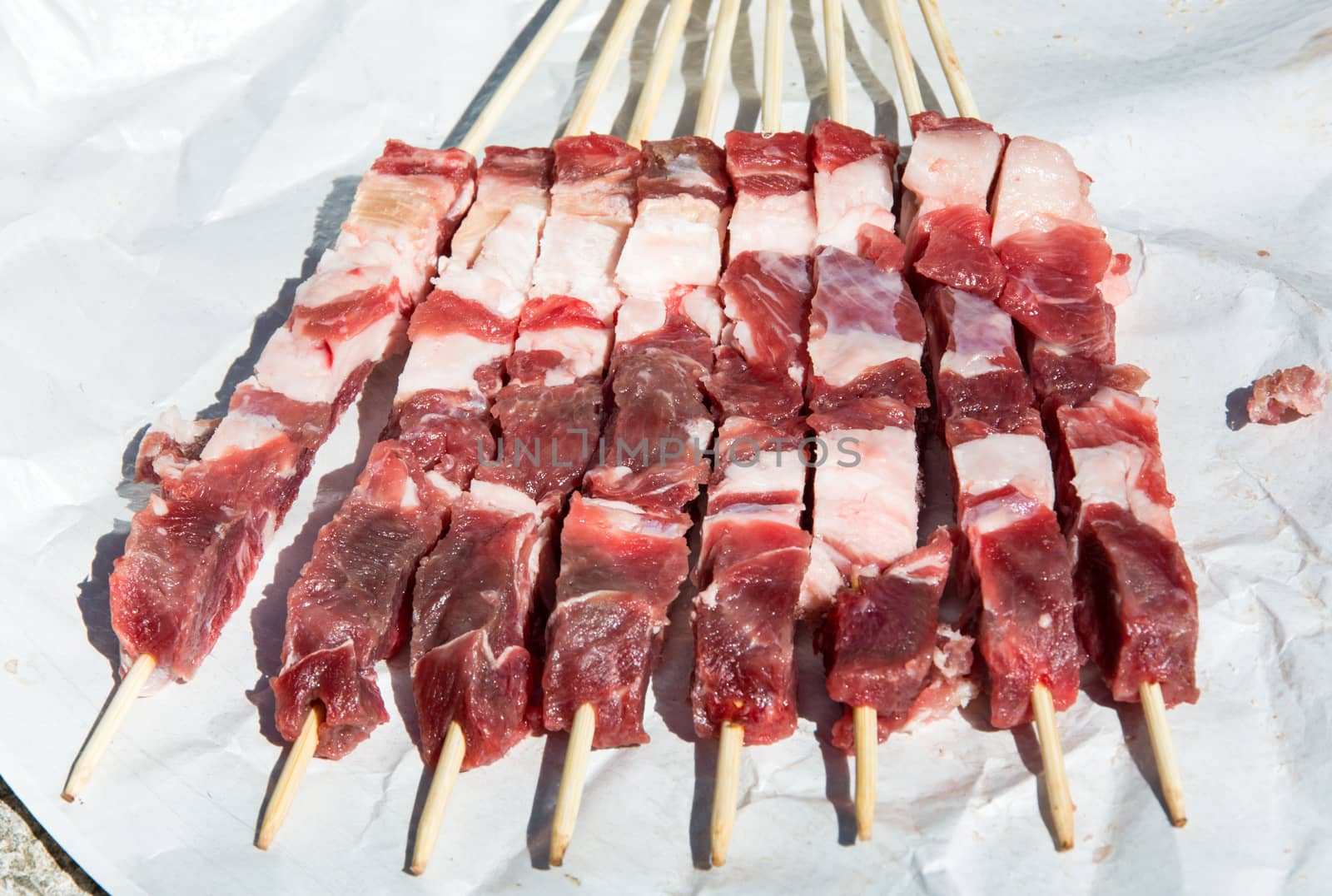 Fresh tipical Abruzzo's sheep skewers: Arrosticini. Outdoor in a sunny day