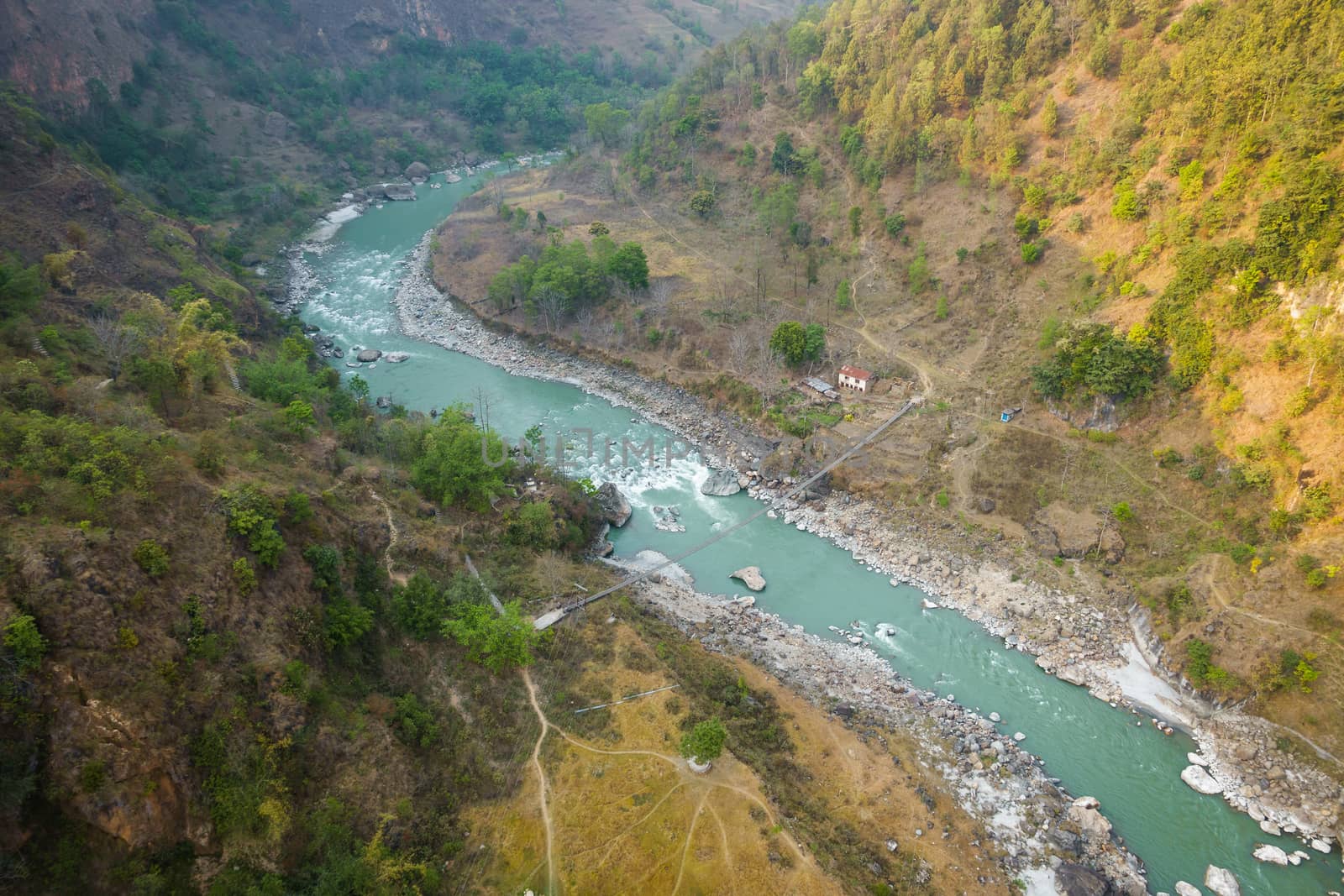 Aerial view of small suspension bridge over the Kali Gandaki river between Kushma and Balewa in Nepal