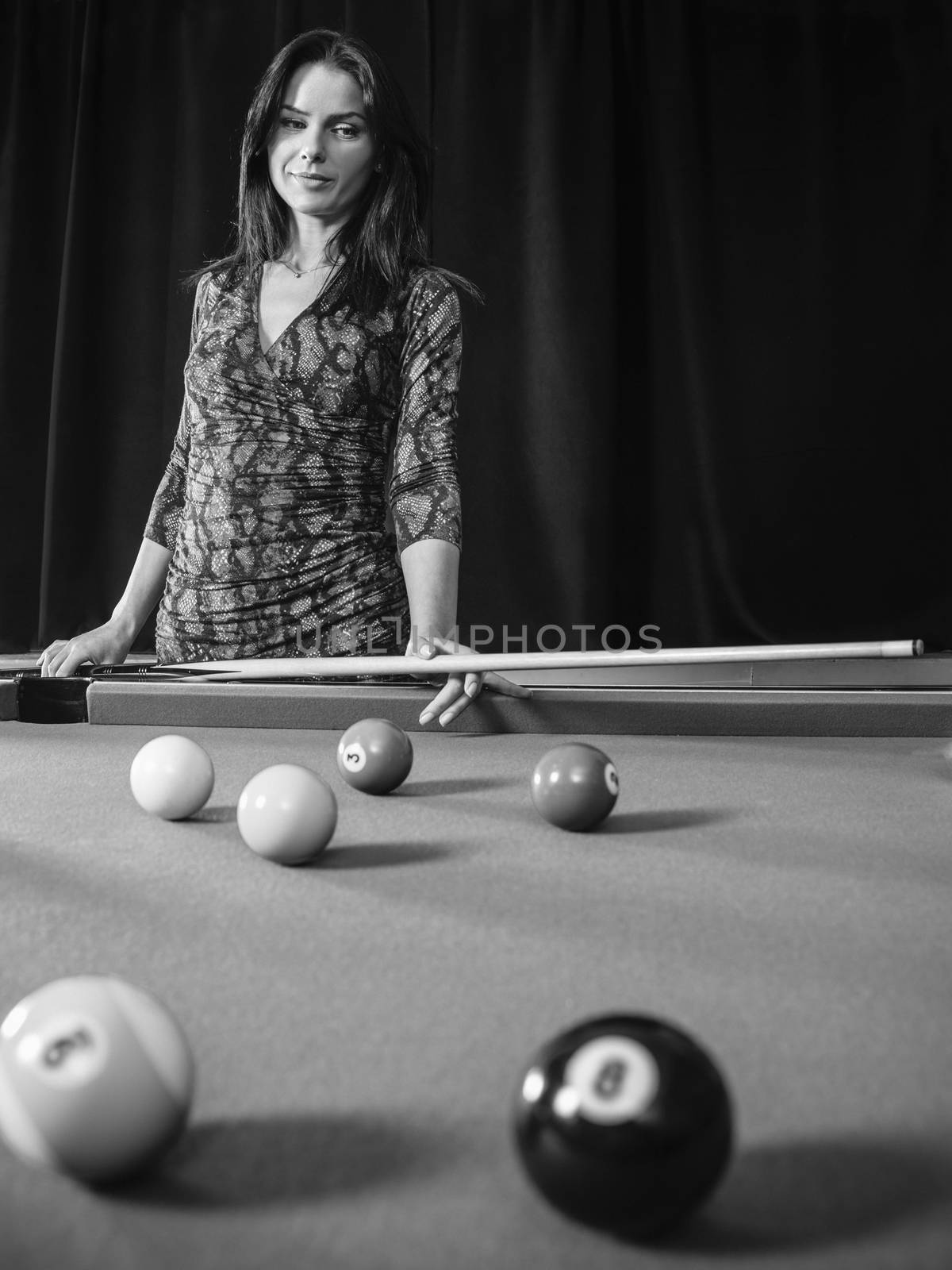 Beautiful woman at the pool table by sumners