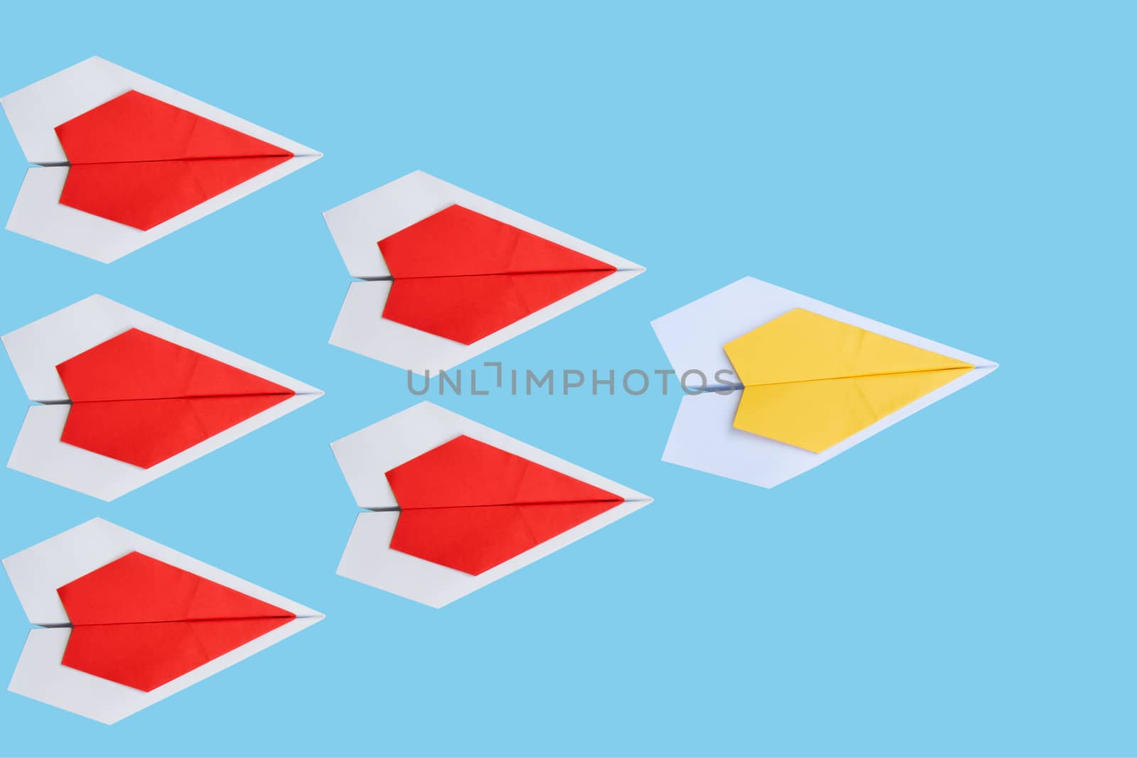 paper yellow airplane as a leader among red airplane , leadershi by kirisa99