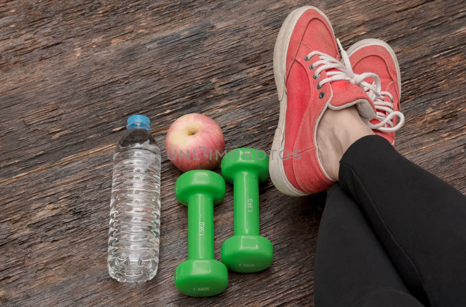 concept preparing to fitness sports equipment top view on wooden background.