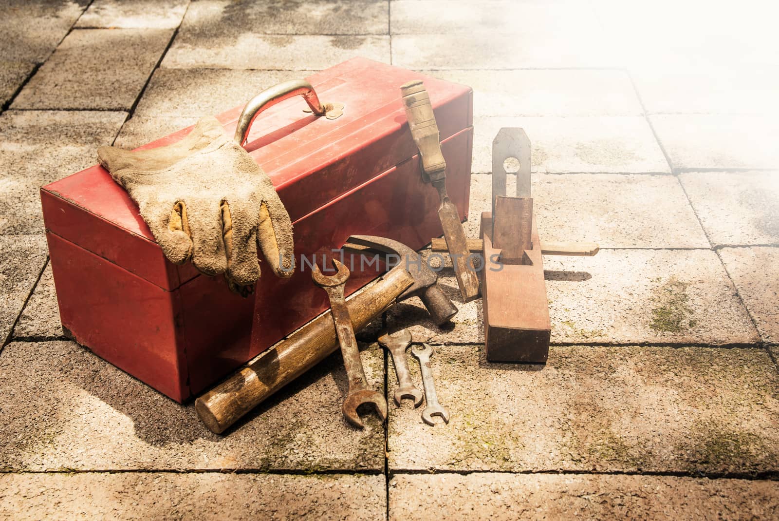 Construction tools with red tools box on brick ground. by kirisa99