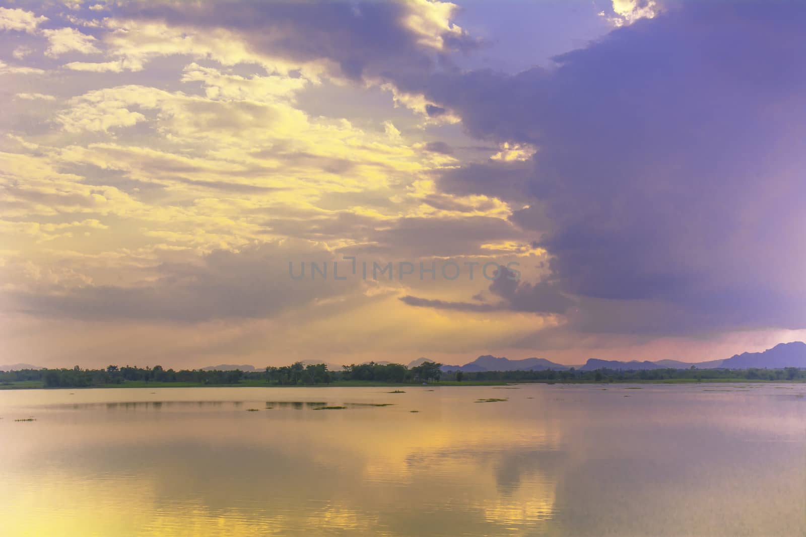 Lake summer view with reflection of clouds on water surface