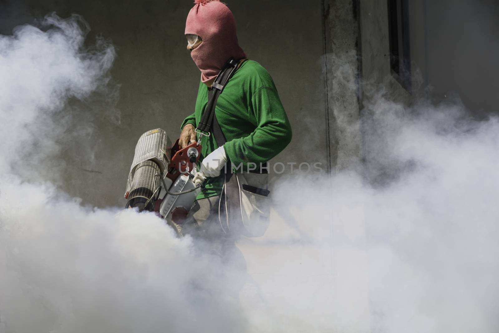 Man work fogging to eliminate mosquito for preventing spread den by kirisa99