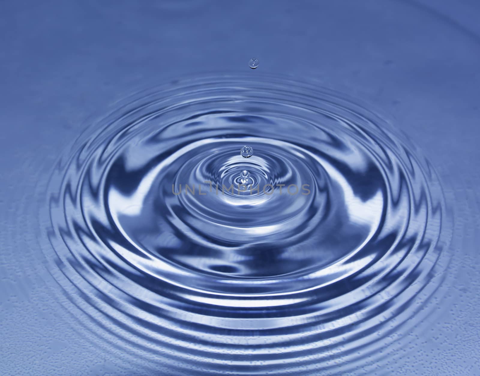 Blue water drop falling down. Blue water splash. by kirisa99