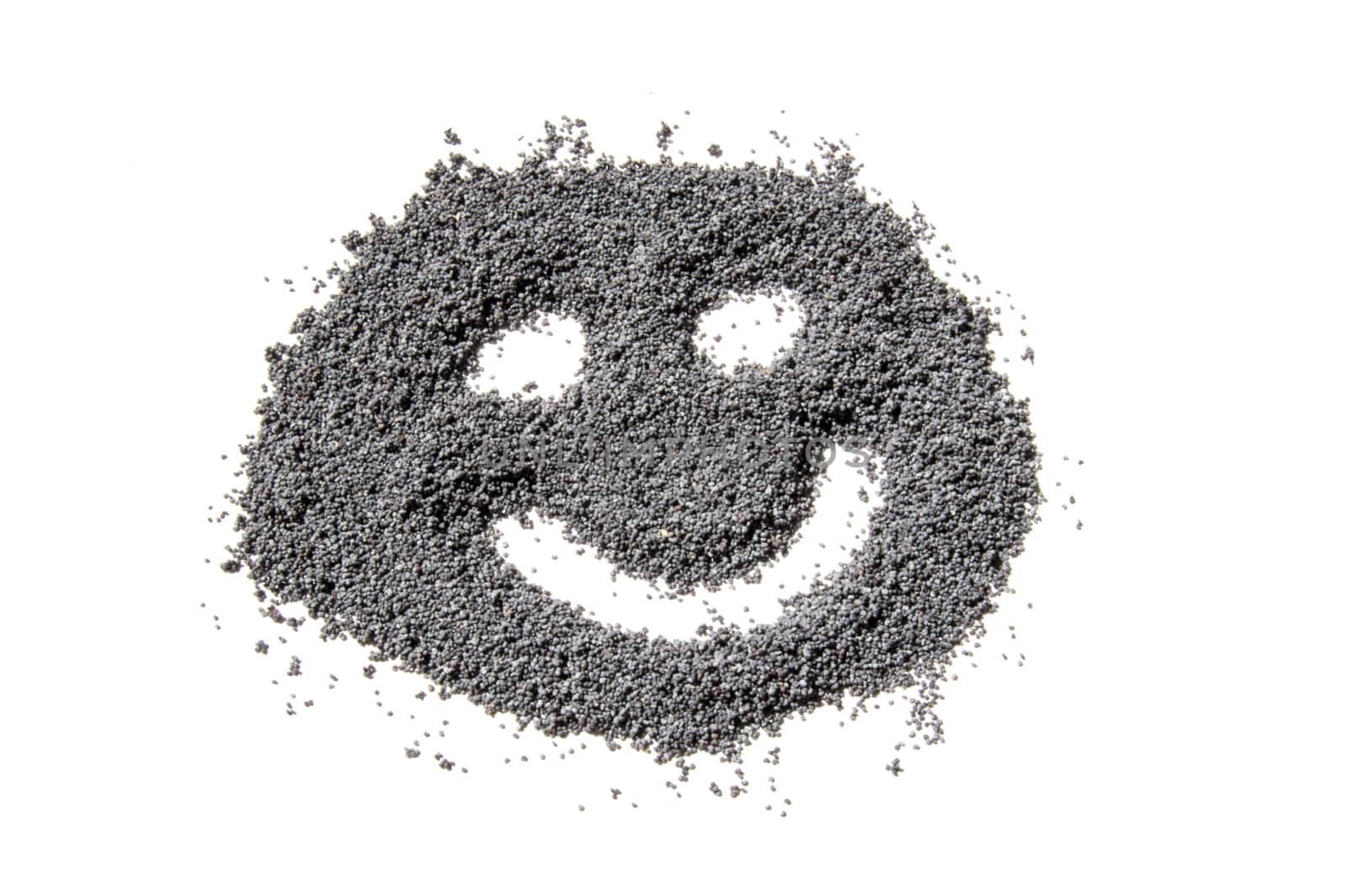 happy face made from dried poppy seeds 