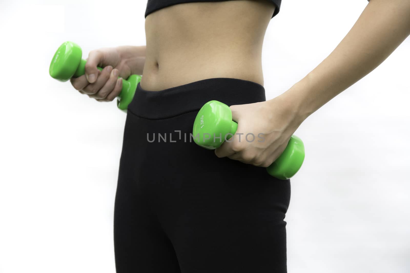 Attractive young fitness woman holding dumbbells isolated on whi by kirisa99