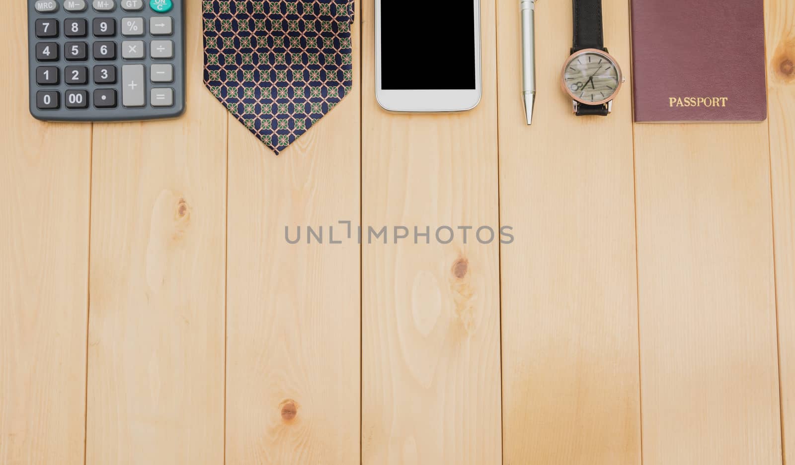 Office table with passport, necktie, calculator, watch and smart by kirisa99