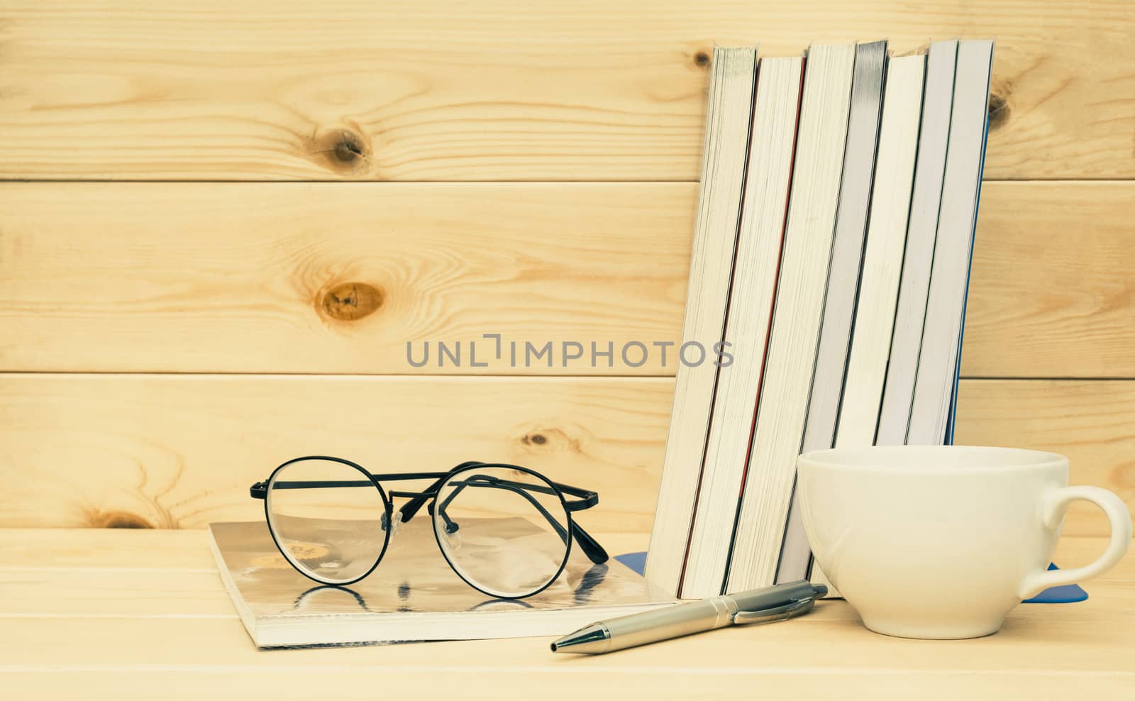 Books with glasses above. Book with glasses and coffee cup on ta by kirisa99