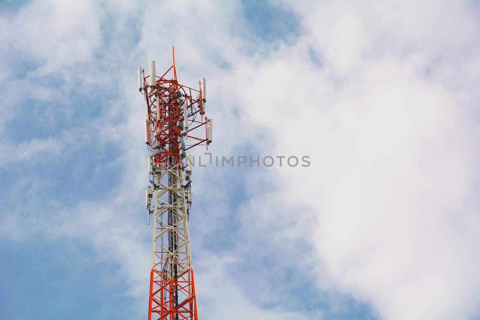 telecommunication mast TV antennas wireless technology under blue sky with cloud